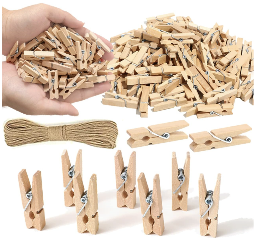 This image shows a bunch of neutral colored, mini clothespins. 