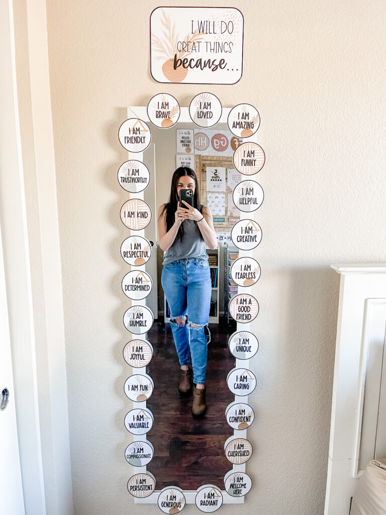 This image shows a long mirror filled with affirmation cards decorated in a boho dreams theme.