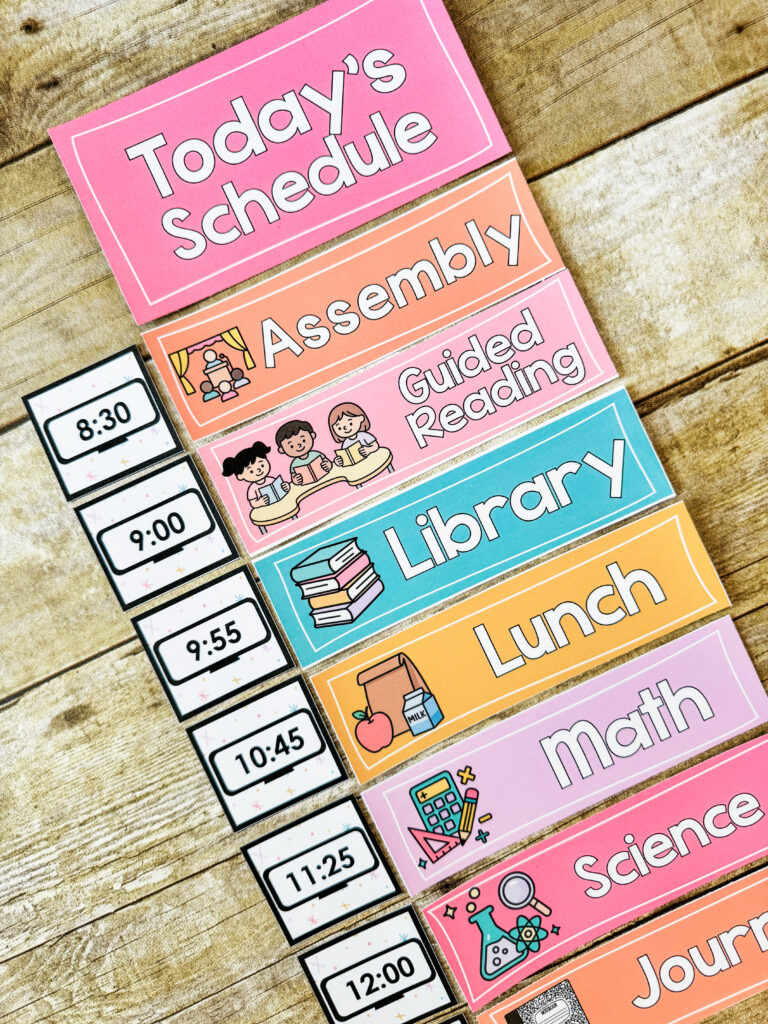 This image shows daily schedule cards for a primary classroom. The cards include the subject title and a picture. There is also a clock next to each subject showing the time for the subject.