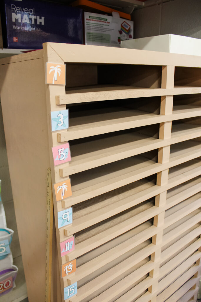 This image shows a student mailbox with little editable labels on the side. The labels have student numbers on them to indicate which mailbox is for which student.