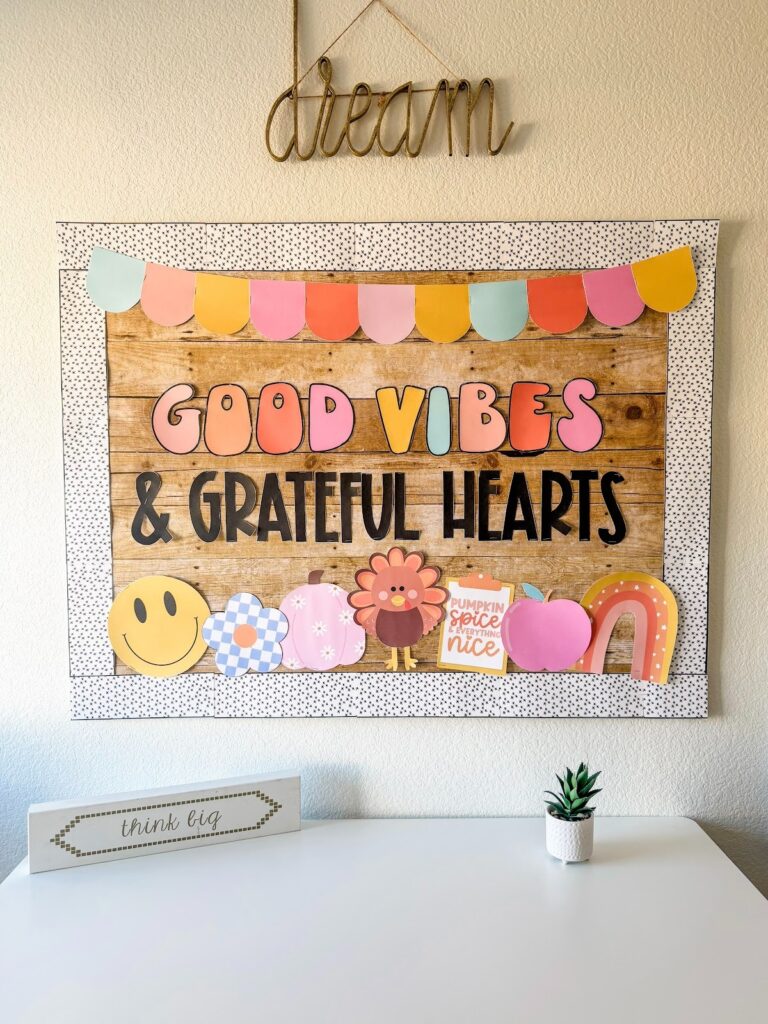 This image shows a fall themed bulletin board that reads Good Vibes and Grateful Hearts with fall themed icons underneath. 