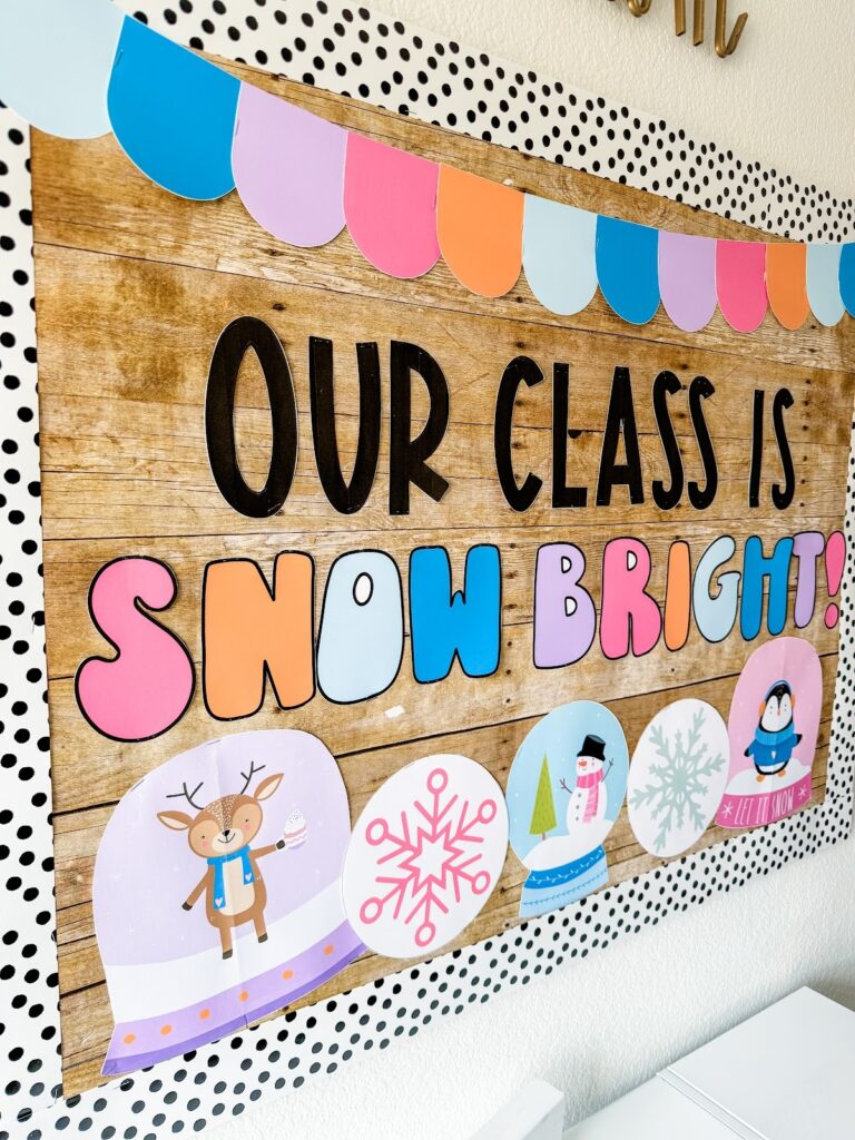 This image shows a winter-themed bulletin board that reads "Our Class is Snowbright" and has snowglobes with a reindeer, penguin, and snowman running along the bottom as decoration.