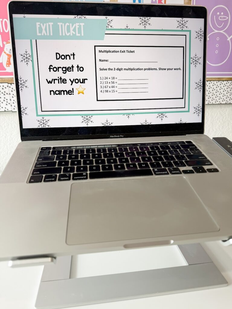 This image shows a computer showing an Exit Ticket slide template designed with a winter theme.