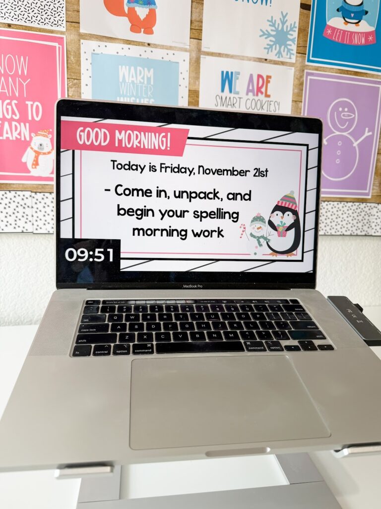 This image shows a computer with a good morning slide template with a winter design. There is a countdown timer in the bottom corner.