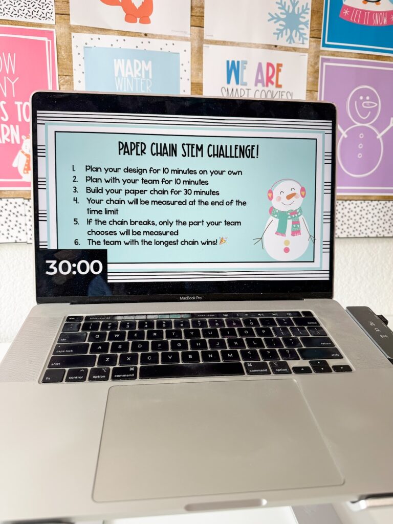 This image shows a list of directions for a STEM activity. In the bottom corner is a festive snowman.