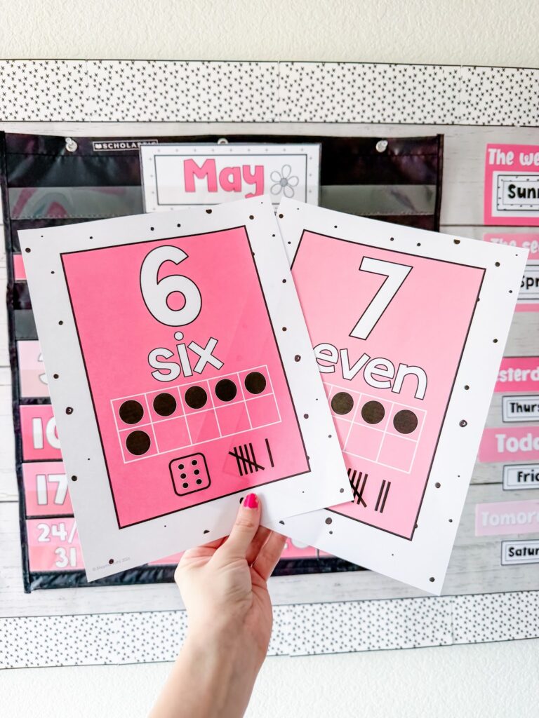 This image shows the number posters included in the simple + pink classroom decor theme. 