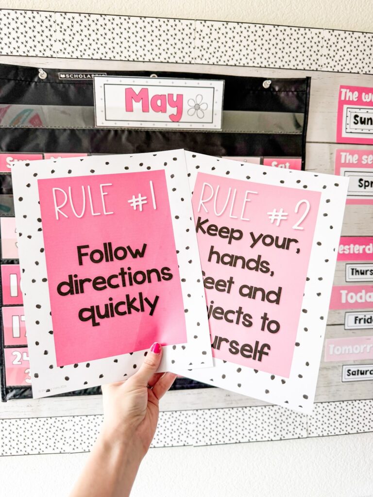 This image shows a close-up of two classroom rules posters. One reads "Rule #1, Follow directions quickly". The other reads "Rule #2, Keep your hands, feet, and objects to yourself." 