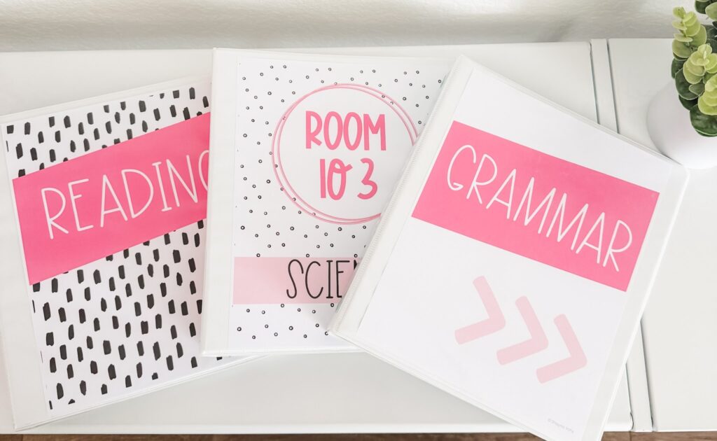 This image shows three white binders with editable binder covers all designed to fit the simple + pink classroom theme. 