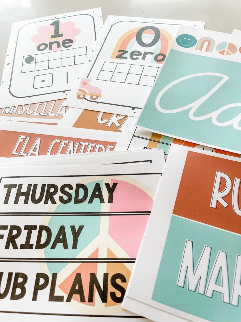 This image shows a pile of papers all included in the Groovy bundle and printed from a home printer. The colors are sharp, and the printed items look professionally done.