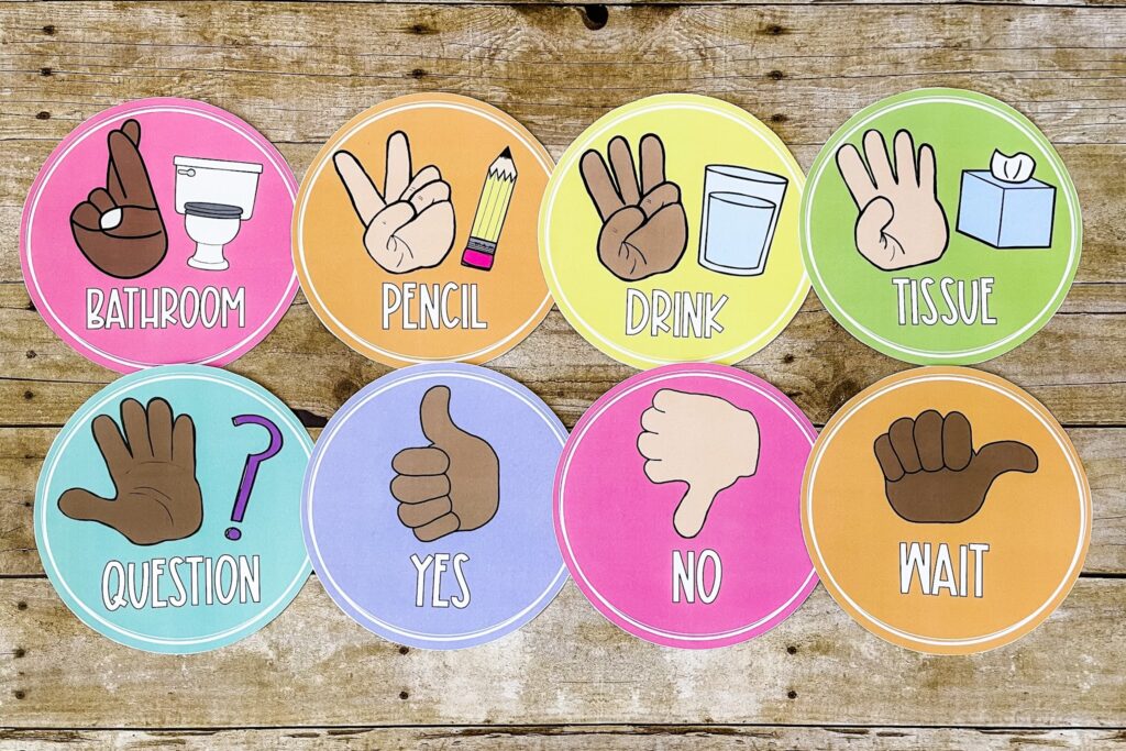 This image shows eight hand signal posters decorated in the happy hues design. These posters are used for students to ask to go to the bathroom, grab a pencil or a drink, or answer yes or no. 