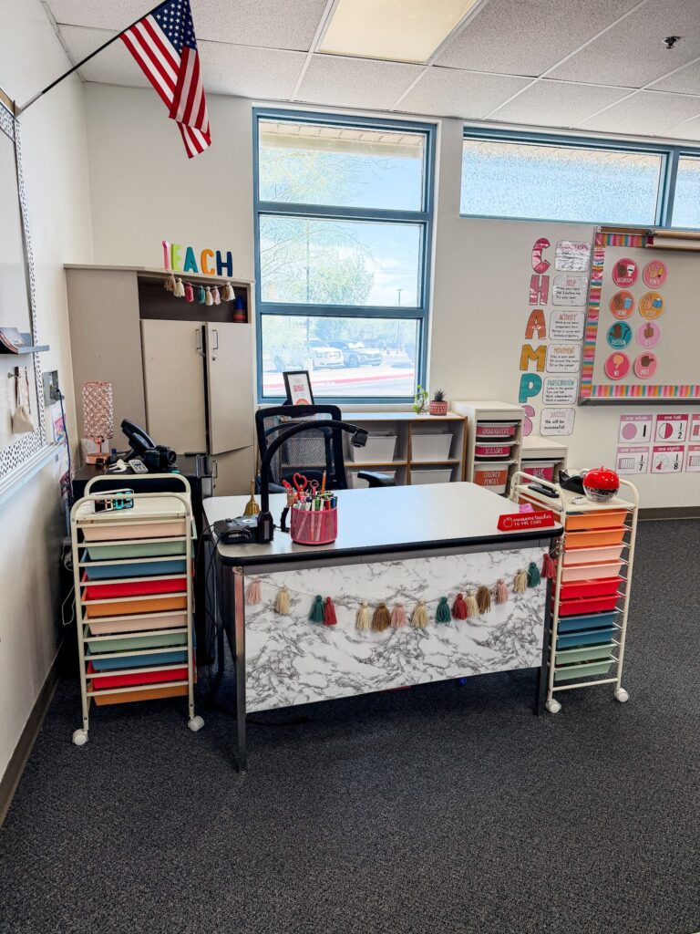 This image shows a teacher corner with 10 drawer carts and lots of fun, bright colors.