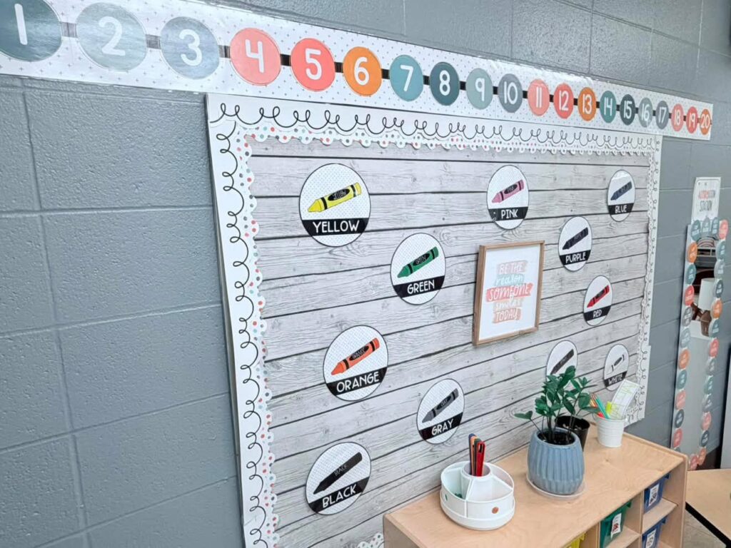 This image shows a bulletin board with different posters highlighting colors (how they are spelled and their names). Above the colors display is a number line.